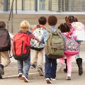 childrenwithbackpacksrunningtoclass