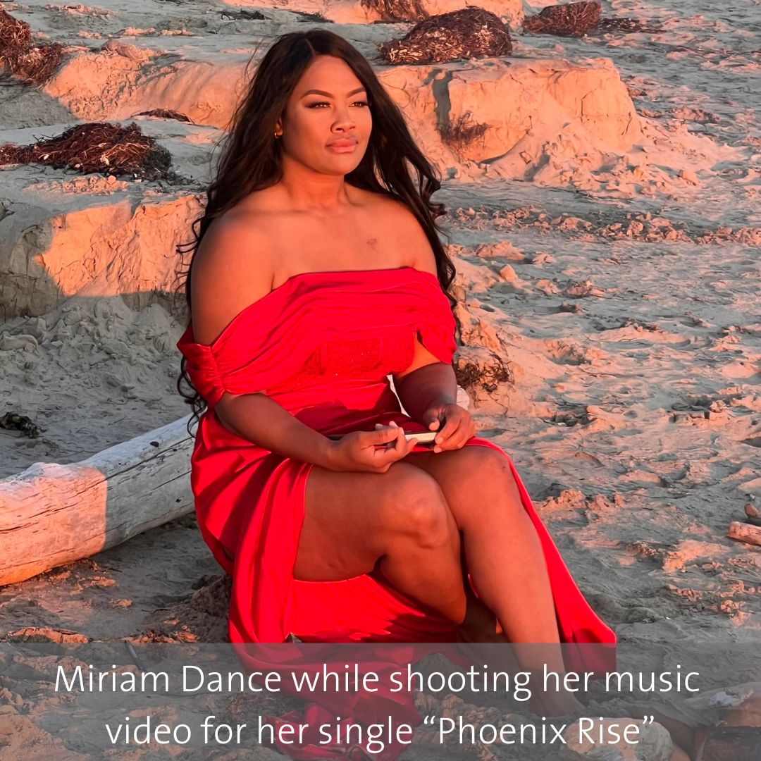 Female on the beach in a red dress