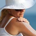 WomanusingSunscreentopreventSkinCancer