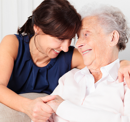 Motheranddaughtersmilingholdinghands