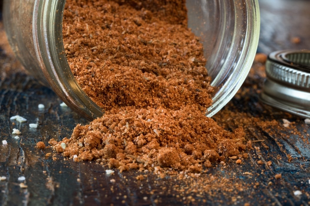 coffee spice rub spilling out of a jar